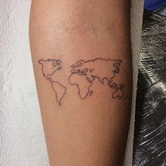 a person with a tattoo on their leg that has a world map drawn on it