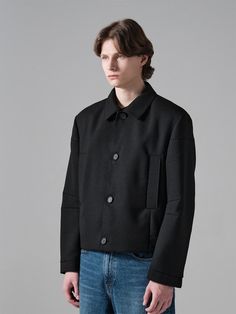 It is a waist-length cropped jacket. The jacket has darts on the back to make extra comfy fit, shoulder pads to make perfect shape, and large pockets on the front as a point. The jacket is made of pure wool blend double fabric which is stretchy and comfy.- Darts on sleeves- Ox horn buttons- Four buttons- Side pockets Classic Structured Black Outerwear, Tailored Long Sleeve Cropped Jacket With Pockets, Structured Black Outerwear For Work, Cropped Outerwear With Patch Pockets For Work, Modern Cropped Jacket With Pockets For Winter, Modern Business Cropped Jacket For Fall, Modern Cropped Jacket For Business In Fall, Modern Cropped Jacket For Fall Business, Structured Black Winter Outerwear