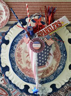 a patriotic themed plate with candy bar and american flag decorations on it, sitting on a table