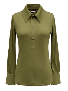 Model Tegan Wears size XXS (5’5” tall, 24” inch waist, 32a” chest, Hips - 35”) The Elita Polo is a slim fit top with a pointed collar, a partial button placket, and button cuffs. This product is made with Merino Wool. The merino is all traceable, non mulesed and RWS certified. All of the polyester used in this yarn is recycled. A luxury wool with inherent performance enhancing qualities: Thermal-regulating, moisture wicking, antimicrobial, water repellant and soft yet durable. - 100% Merino Wool 24 Inch Waist, Moisture-wicking Four-way Stretch Collared Polo Shirt, Green Polo Collar Sporty T-shirt, Green Moisture-wicking Polo Collar Top, Moisture-wicking 4-way Stretch Collared Polo Shirt, Moisture-wicking Polo Collar Sports Shirt, Custom Leather Belts, Wool Turtleneck, Slim Fit Top