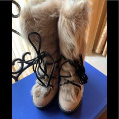 Beige Suede Shearling Lamb Boots Mukluks Go Mod On This Wedge-Heeled Boot Crafted From Beige Suede Leather And Genuine Lamb Fur For Statement Tundra Style. 4 1/4" (107mm) Heel; 1 1/4" Platform (Size 8) - 7" Shaft - Lace-Up Style - Leather And Genuine Lamb Fur (Italy) Upper/Leather Lining/Synthetic Sole - Made In Spain Wedge Heel Boots, Wedge Boots, Up Styles, Stuart Weitzman, Wedge Heels, Suede Leather, Rain Boots, Heeled Boots, Fur Coat