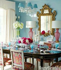 the dining room is decorated in blue and pink