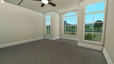 an empty room with three windows and a ceiling fan