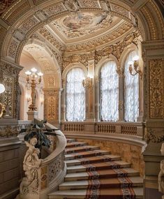 an ornate staircase in the middle of a building