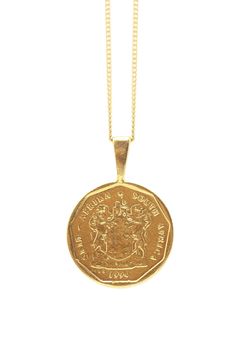 THE SOUTH African Lily Coin Necklace is handcrafted from an authentic South African coin with precious metals using the traditional lost-wax casting technique. The design features the the South African coat of arms, and one of the nation's celebrated flowers the Arum Lily on the flip side. The date of issue 1994, is in commemoration of when Nelson Mandela took office as the nation's first post-apartheid president.Metal Info & CareAvailable in: Sterling Silver, 18K Gold Vermeil (18K Gold over South African Coat Of Arms, African Lilies, African Lily, Africa Necklace, Arum Lily, Ankh Necklace, Gold Coin Necklace, Hamsa Necklace, Infinity Necklace