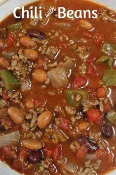 a white bowl filled with chili and beans