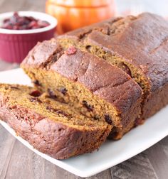 there is a loaf of fruit bread on the plate