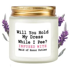 a white jar filled with lavender flowers and the words will you hold my dress while i pee?