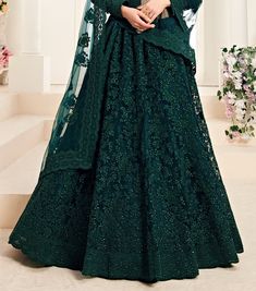 COLOR : Peacock Green FABRIC : Top (Blouse) - Net, Bottom (Lehenga) - Net, Inner - Silk Satin & Premium Can-Can, Dupatta - Net WORK : Heavy Silk Thread Embroidery, Heavy Stone Work, Cutwork, Cording Embroidery OCCASION : Wedding, Reception, Sangeet, Engagement READY-TO-WEAR : NoSTITCHING : Available as semi-stitched fabric, can be stitched using standard size option (+$30). Note: There might be a slight color variation due to lighting and flash used during photoshoot. The bright shade seen is th Anarkali Sets With Peacock Design For Wedding, Anarkali Lehenga With Peacock Design For Diwali, Bollywood Style Wedding Lehenga With Peacock Design, Diwali Anarkali Lehenga With Peacock Design, Traditional Drape Lehenga With Peacock Design, Bollywood Lehenga With Peacock Design In Traditional Drape, Festive Anarkali Set With Peacock Design, Bollywood Style Lehenga With Peacock Design, Semi-stitched Dupatta With Peacock Design For Wedding