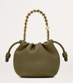 Find LOEWE Mini Flamenco Shoulder Bag on Editorialist. The LOEWE Mini Flamenco Shoulder Bag features a relaxed silhouette with a gold-tone pebble-shaped chain handle. It is a mini bags shoulder bag with a drawstring closure and a top handle. The bag can be worn on the shoulder. Loewe Mini Flamenco, Jonathan Anderson, Green Clay, Green Bottle, Novelty Bags, Bottle Green, Fine Watches, Trainer Boots, Shoes Heels Pumps