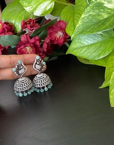 Elegant AD black finished  jumkas  for your ethnic party wear dresses. Weight of both the Jhumkas together  : 1.8 Oz. Product care: Avoid contact with Chemicals such as Perfumes or any Sprays. Prevent the Jewellery from the water. Use Butter Paper or Cotton Cloth to store your Jewellery for a longer Product life. Peacock Design Jhumkas For Party And Festivals, Party Chandbali Jhumkas With Peacock Design, Party Peacock Design Chandbali Jhumkas, Party Peacock Design Jhumkas For Festivals, Festival Peacock Design Jhumkas For Parties, Peacock Design Chandbali Jhumkas For Party, Party Jhumkas With Peacock Design, Hand Set Temple Jewelry Jhumkas For Party, Festive American Diamond Jhumkas With Meenakari