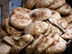 there are many breads stacked on top of each other in this pile, and one is brown