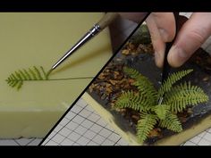 a person cutting into a piece of cake with a green leaf on it and a knife