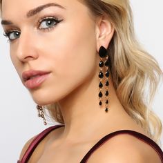 Feel elegant in these teardrop dangle earrings that flow with any outfit and elongate your neck. Cascading teardrop rhinestones that dangle in two tiers from large to small sizes with a post backing great for girls, teens, and women that have their ears pierced! These beautiful statement jewelry will shine like a diamond catching everyone’s eyes! Size• Length: 3.75 in (9.53 cm)• Width: 0.5 in (1.27cm) Quality These well designed post backing earrings use an eco-friendly, lightweight, strong gold Metal Drop Crystal Earrings For Party, Glamorous Metal Teardrop Earrings, Crystal Long Drop Chandelier Earrings, Crystal Teardrop Earrings For Party, Long Drop Crystal Chandelier Earrings, Glamorous Evening Teardrop Drop Earrings, Party Teardrop Dangle Earrings For Pierced Ears, Teardrop Crystal Earrings For Evening, Evening Teardrop Earrings With Rhinestones