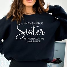 Matching Shirts For Sisters, Fun Mothers Day Shirts I am the oldest Youngest Middle sister Unisex Crewneck Sweatshirt Including Youth Shirts This sweatshirt is the perfect gift for your loved one or for yourself! Design is printed on your custom shirt via DTG method. NO Vinyl FUN GIFT IDEAS Check out our shops here: https://www.etsy.com/shop/VCApparelCreations https://vcapparelcreations.etsy.com https://vcgiftstores.com SHIRT SIZING ✨ All of our shirts are UNISEX sweatshirts and made with the highest quality materials and are super soft and cozy!  They are 50% Cotton 50% Polyester. Unisex shirts generally run slightly larger than women's shirts and slightly smaller than typical men's shirts. Very close to True to size. If you're looking for a more fitted look, we recommend sizing down and Sister Hoodies Matching, Matching Family Sweatshirts Funny, Sister Sweatshirts, Fun Gift Ideas, Middle Sister, Reunion Shirts, Sibling Shirts, Sisters Funny, Sister Tshirts