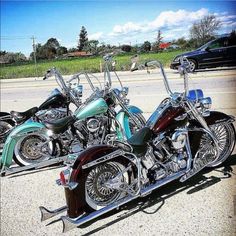 three motorcycles parked next to each other in a parking lot