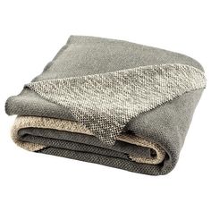 the grey blanket is folded on top of each other and ready to be used as a bed