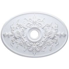 an ornately decorated ceiling medallion in white