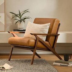 a brown chair sitting on top of a wooden floor