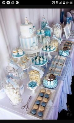 the dessert table is set up with cupcakes, cookies and other treats for a frozen princess birthday party