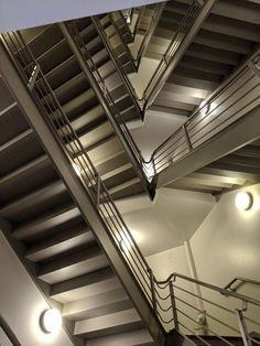 the inside of a building with stairs and lights