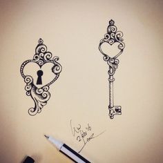 a pen is sitting next to a drawing of two keys and a keyhole in the shape of a heart