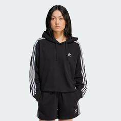 adidas Adicolor 3-Stripes Short Hoodie - Black | Women's Lifestyle | adidas US Sporty Hoodie With Ribbed Cuffs For Spring, Spring Sportswear Hoodie, Sporty Spring Hoodie With Ribbed Cuffs, Adidas Three Stripes Sweatshirt Sportswear, Adidas Sportswear Sweatshirt With Three Stripes, Adidas Athleisure Hoodie With Ribbed Cuffs, Adidas Sportswear Hoodie With Ribbed Cuffs, Black Adidas Logo Sweatshirt, Adidas Sporty Sweatshirt For Streetwear