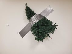 a sculpture made out of duct tape and trees