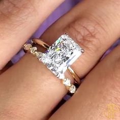 a woman's engagement ring with a princess cut diamond