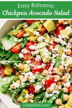 a salad with chickpea, avocado and feta cheese on top