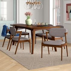 a dining room table with chairs around it