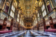 the inside of an ornate building with checkered floor