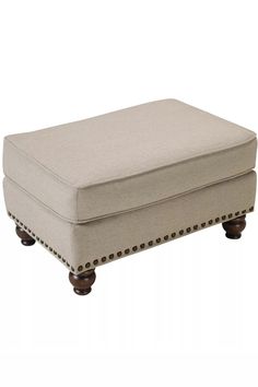 the footstool is made out of wood and has studded trimmings