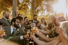 a group of people sitting around each other at a wedding