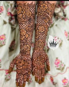 the hands and feet of a woman with henna tattoos on their arms are shown