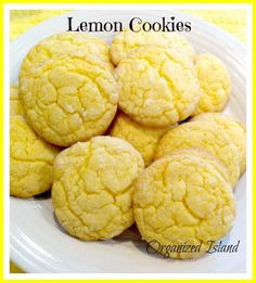 a white plate topped with lemon cookies on top of a table