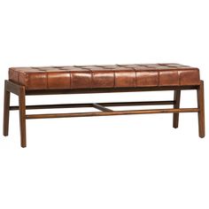 a brown leather bench sitting on top of a wooden frame