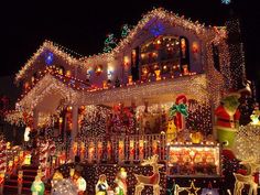 a house covered in christmas lights and decorations