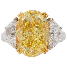 This gorgeous 10.03 carat fancy yellow diamond is like wearing a piece of sunshine! Exceptionally sparkly and with beautifully vibrant color, this is a truly magnificent piece. Graded by GIA as a fancy yellow color and VS2 clarity, the center diamond is set in 18K yellow gold so the prongs will disappear against the stone. Two half moon diamonds which total 2.41 carats provide brilliance contrast against the yellow center diamond. The rest of the setting is crafted in platinum with an open, airy Dig Jewelry, Asscher Cut Diamond Ring, Big Diamonds, Fancy Yellow Diamond Ring, Radiant Cut Diamond Ring, Fancy Diamond Ring, Yellow Diamonds Engagement, Canary Diamond, Yellow Diamond Ring