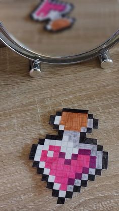 an image of a pixel art piece on a table with a mirror in the background