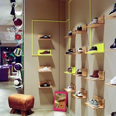 a store with shelves filled with different types of shoes