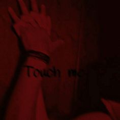 a person's hand with the word touch me written on it