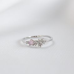 Our feminine Ria Ring features a butterfly design embellished with a pink stone and circle cut crystals on a dainty band.  Main material: Rose Gold, Rhodium, 16k Gold Plated on Brass, Cubic Zirconia Tarnish-resistant protective coating Need some jewelry inspiration? Follow us on Instagram  @statementGrey Trendy Rings, Delicate Butterfly, Dainty Band, Trendy Ring, Butterfly Ring, Gifts For My Sister, Affordable Jewelry, Silver Pieces, Pink Stone