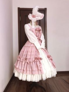 Experience timeless elegance with our Pink House Fashion Classic Lolita Dress. This exquisite piece features a full-length button closure at the front, perfect for pairing with an underskirt to achieve a stunning Rococo-inspired look. The shirring back ensures a comfortable fit, accommodating a range of body types. Available in plus sizes and offered in four enchanting colors, this dress seamlessly combines classic charm with modern comfort.  Please note: This listing is for the strap dress only Pink Skirt For Spring Costume Party, Pink Fitted Skirt For Costume Party, Fitted Pink Skirt For Costume Party, Elegant Pink Costume Dress, Spring Pink Petticoat With Attached Cancan, Elegant Pink Petticoat, Fitted Pink Petticoat With Ruffled Skirt, Elegant Pink Petticoat For Spring, Elegant Pink Spring Petticoat