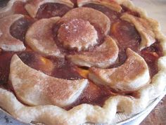 an apple pie is shown on a table