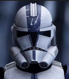 a star wars character is wearing a helmet