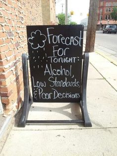 a chalkboard sign on the side of a building that says, forest for tonight aloh standards poor decision