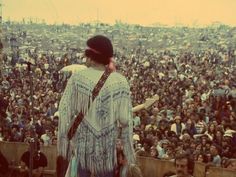 a man standing in front of a large crowd