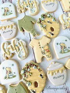 decorated cookies are arranged on a white table