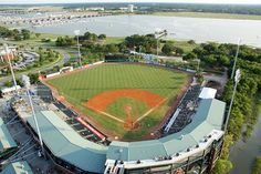 an aerial view of a baseball field and water